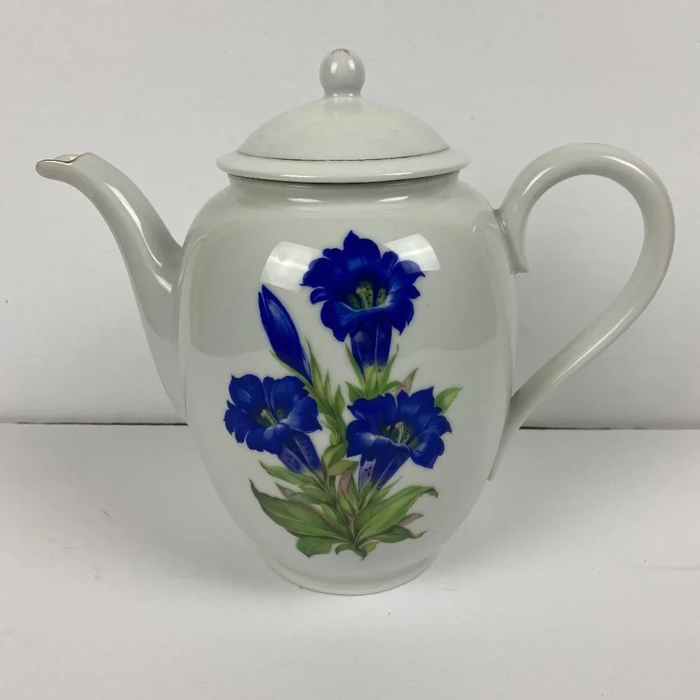 Vintage porcelain large tea pot with the floral decor
